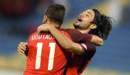 Al Rayyan striker Rodrigo Tabata (right) celebrates with a team-mate after scoring a goal against Umm Salal in the QNB Stars League Week 10 match on Saturday. 