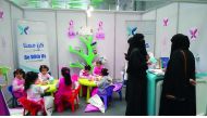 Children engage in various activities at the QCS pavilion.