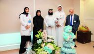 H E Dr Hanan Mohamed Al Kuwari, Minister of Public Health, with the newborn baby, parents and medical staff. 