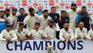 The Indian cricket team pose with the trophy after winning the third Test cricket match series against Sri Lanka at the Feroz Shah Kotla Stadium in New Delhi on December 6, 2017. (AFP / SAJJAD HUSSAIN)