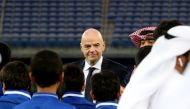 FIFA president Gianni Infantino (C) attends a tour of the Sheikh Jaber Al-Ahmad International Stadium in Kuwait City on December 6, 2017. / AFP / Yasser Al-Zayyat
