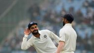 (FILES) This file photo taken on December 5, 2017 shows Indian team captain Virat Kohli (L) gesturing towards the crowd as teammate Shikhar Dhawan looks on during the fourth day of third Test cricket match between India and Sri Lanka at the Feroz Shah Kot