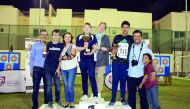 Some of the winners of the tournament with their trophies.