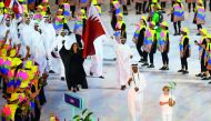 Sheikh Ali Khalid Al Thani, flagbearer of Qatar at the Rio Olympics, leads his contingent during the opening ceremony at the Maracana Stadium in Rio de Janeiro in this August 5, 2016 file photo.