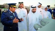 Dr Khalid bin Ibrahim Al Sulaiti (third left), General Manager of Katara, and Brig. Gen. Rashid bin Mubarak Al Mannai (left), from Qatar Emiri Air Force, during the opening of National Day celebrations at Katara yesterday. Pic: Abdul Basit / The Peninsula