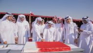 Mohammed Khalifa Al Suwaidi and Ali Salem Afifa cutting the QND celebration cake.