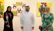 Katara General Manager Dr. Khalid bin Ibrahim Al Sulaiti with Qatari artist Lina Al Ali and Kuwaiti artist Anfal Al Yaquot.