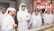 Emir H H Sheikh Tamim bin Hamad Al Thani visiting a pavilion after inaugurating the ‘Made in Qatar’ exhibition at Doha Exhibition and Convention Center, yesterday.