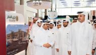 Emir H H Sheikh Tamim bin Hamad Al Thani and the Minister of Energy and Industry H E Dr Mohammed bin Saleh Al Sada taking a tour of the fifth edition of ‘Made in Qatar’ exhibition after the inauguration at DECC, yesterday. 