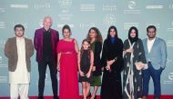 Georgetown University students and CIRS filmmaker Suzi Mirgani pose for a photograph at Ajyal Film Festival. 