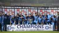 Indian cricket team pose as they hold the One Day series cup after wining the third One Day International (ODI) cricket match between India and Sri Lanka at the Dr. Y.S. Rajasekhara Reddy ACA-VDCA Cricket Stadium in Visakhapatnam on December 17, 2017. (AF