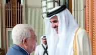 Emir H H Sheikh Tamim bin Hamad Al Thani receiving Palestinian President Mahmoud Abbas.