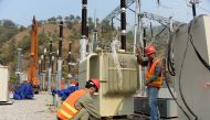 This photograph taken on November 1, 2017, shows Chinese engineers working on a power distribution point of the Neelum-Jhelum Hydropower Project in Chattar Klass on the outskirts of Muzaffarabad, the capital of Pakistan-administered Kashmir.  AFP / SAJJAD
