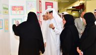 Dr Latifa Al-Meghaissib Assistant Professor of Educational Sciences explain the paintings to the attendees