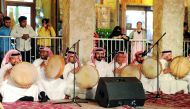 A traditional Qatari band enthrals the crowd with their performance at Al Ahmed Square in Souq Waqif yesterday as part of the Souq Waqif Spring Festival. Pic: Abdul Basit / The Peninsula