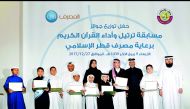 Fawzia Al Khater, Assistant Under-Secretary for Educational Affairs at the Ministry of Education and Higher Education; honouring students and Hassan Al Jafali Al Nuaimi, Assistant General Manager of Banking Services at Qatar Islamic Bank; and Hassan Al Ba