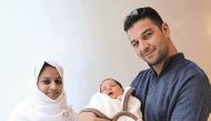 Baby Yassim Ahmed Abdelsalm with his father Ahmed Abdelsalm and Staff Nurse, Shahina Aboobaker.