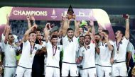 Al Sadd players lift Qatar Cup. 