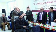 Palestinian families receiving keys of their newly reconstructed apartments in Al Dafer Tower in Gaza Strip. 