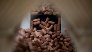 Cork stoppers are carried through a machine in Amorim Revestimentos factory unit in Sao Paio de Oleiros, Portugal, April 11, 2017. Reuters/Pedro Nunes