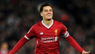 (FILES) This file photo taken on December 26, 2017 shows Liverpool's Brazilian midfielder Philippe Coutinho celebrating scoring the opening goal of the English Premier League football match between Liverpool and Swansea City at Anfield in Liverpool, north