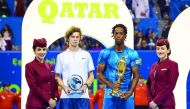 Gael Monfils and Andrey Rublev with their trophies.