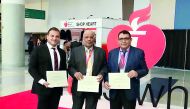 Dr Charbel Abi Khalil, Dr Jassim Al Suwaidi and Dr Nidal Assad with the award.