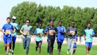 Four-time Olympic champion Mo Farah and other running stars train with young Aspire Academy’s athletes yesterday. 