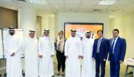 QNCECS Secretary-General, Dr. Hamda Hassan Al Sulaiti, and other officials at a workshop on the use of the electronic application for people with disabilities.