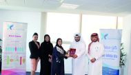 Dr Dera Al Dosari, Public Relations and Marketing Manager of QCS, with Qatar Airways’ delegation at QCS headquarters receiving the donation.