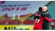 Qatar coach Felix Sanchez celebrates with striker Almoez Ali after the latter scored the winning goal against Uzbekistan during the AFC U-23 Asian Cup in China on January 9.