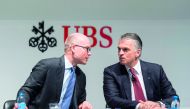 Sergio Ermotti (right) CEO of Switzerland’s bank UBS, speaks with Hubertus Kuelps, Group Head of Communications, during a press conference in Zurich, Switzerland, yesterday.