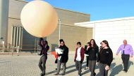 Scientists at HBKU’s Qatar Environment and Energy Research Institute with a weather balloon as part of Near Space Anthem Project. 