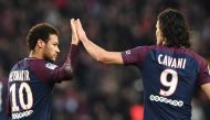 Paris Saint-Germain's Brazilian forward Neymar (L) is congratuled by Paris Saint-Germain's Uruguayan forward Edinson cavani after scoring a penalty kick during the French L1 football match between Paris Saint-Germain (PSG) and Montpellier (MHSC) at the Pa