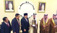 The Speaker of the Advisory Council H E Ahmed bin Abdullah bin Zaid Al Mahmoud with Indonesian Deputy Speaker of the House of Representative, Dr Fadli Zon and his accompanying delegation and other Qatari officials, during a ceremony. 