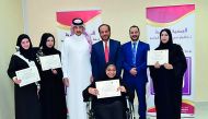 Participants and officials during the training organised by Qatar Foundation For Rehabilitation Of Special Needs. 
