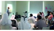Attendees listening to a speaker during a workshop.
