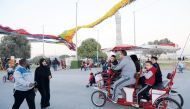 People enjoying cool weather at the Aspire Park in Doha, yesterday. Cold winds have continued to bring the mercury down for the last couple of days. Salim Matramkot/The Peninsula
