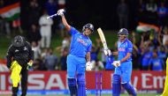 India's Manjot Kalra (C) celebrates the team's victory with teammate Harvik Desai during the U19 cricket World Cup final match between India and Australia at Bay Oval in Mount Maunganui on February 3, 2018. AFP / Marty MELVILLE