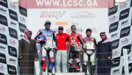 The podium winners of the Qatar Superstock600 Championship (QSTK) are seen with officials of Qatar Motor and Motorcycle Federation at Losail International Circuit.