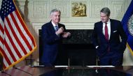 Jerome Powell (left) with Vice Chair for Supervision Randal K Quarles, after he signed documents during a swearing-in ceremony, yesterday, at the Federal Reserve in Washington, DC, the US.