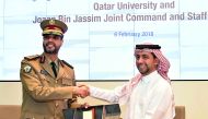 Dr Hassan Al Derham (right) and Major General Staff Mohammed Hamad Mohammed Al Naimi, at the signing event.