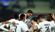 Al Sadd players celebrate after Jugurtha Hamroun scored their first goal against Al Rayyan in the Qatar Clasico at the Al Sadd Stadium yesterday. Al Sadd evened out with Al Rayyan in this season’s Qatar Clasico by registering a comfortable 2-0 victory in 