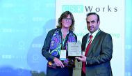 The Director of Tarsheed and Energy Efficiency at Kahramaa receiving sustainability award in Singapore.