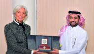QU President Dr Hassan Al Derham presenting a memento to Christine Lagarde, Managing Director of International Monetary Fund. 