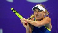 Denmark’s World number one Caroline Wozniacki returns the ball to Carina Witthoeft of Germany during their second round match of the Qatar Total Open 2018 at the Khalifa International Tennis and Squash Complex in Doha yesterday. Picture: Salim Matramkot/T