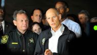 Florida Governor Rick Scott speaks to the media as he visits Marjory Stoneman Douglas High School following a shooting that killed 17 people on February 14, 2018 in Parkland, Florida. AFP / Gaston De Cardenas