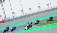 Riders in action during the Qatar Superstock 600 Superpole  at the Losail International Circuit yesterday.  INSETS: (Top left) Hamad Al Asam in action during the qualifying round of the Qatar Touring Car Championshi fourth round. (Top right) Qatari rider 