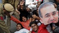  An activist of the youth wing of India's main opposition Congress party holds a cut-out with an image of billionaire jeweller Nirav Modi during a protest in New Delhi, India February 16, 2018. Reuters/Saumya Khandelwal
