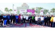 Doha Bank employees with others during the activities organised by Qatar Central Bank to commemorate National Sport Day. 
